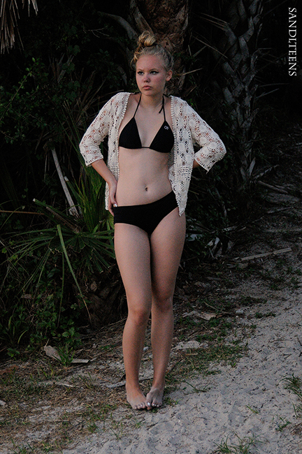 tall pretty teen female wearing black bikini and lace coverup
