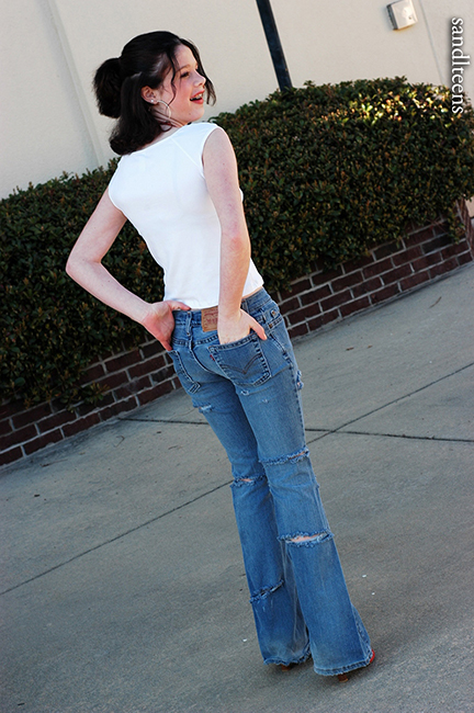teen female model wearing jeans and top